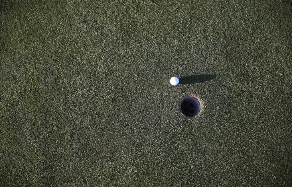 Golf ball near hole 