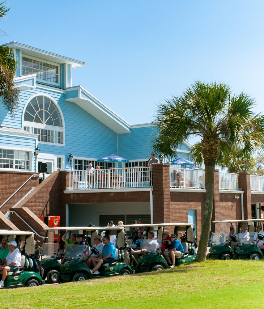 Golfers on carts near clubhouse